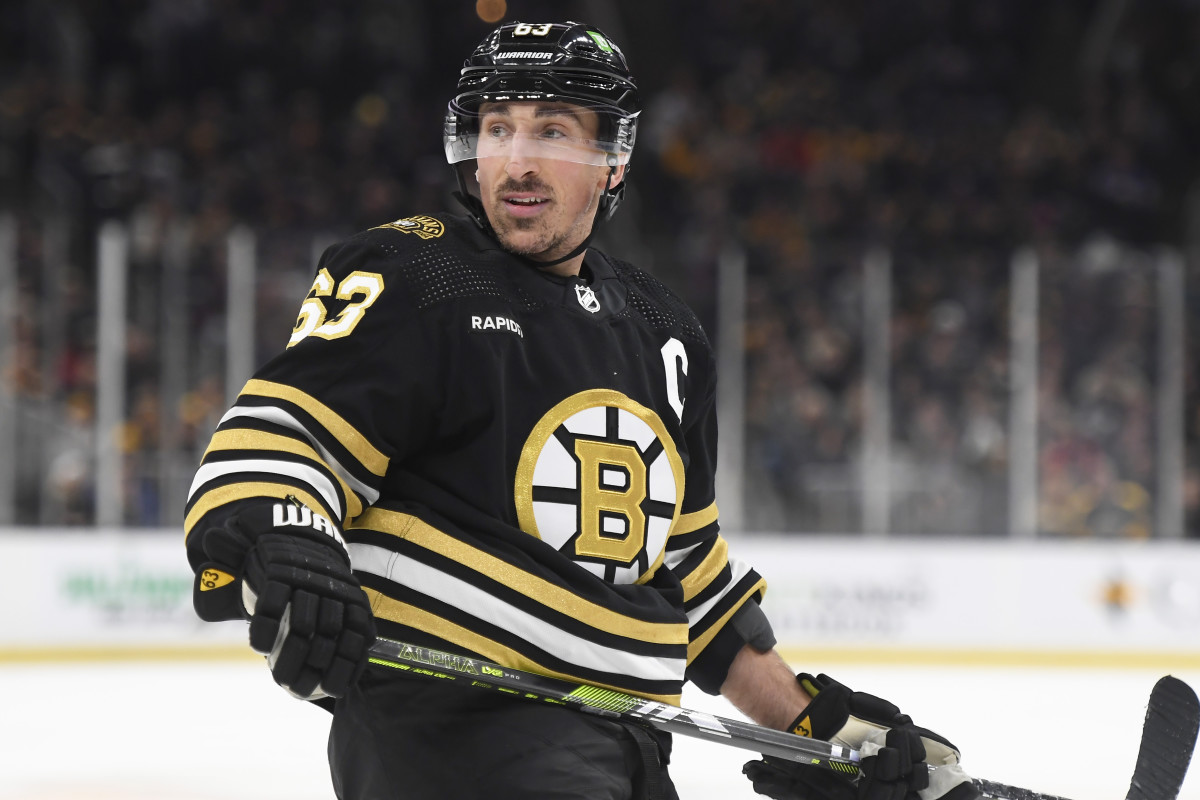 Boston Bruins left wing Brad Marchand (63) looks over at the linesman.