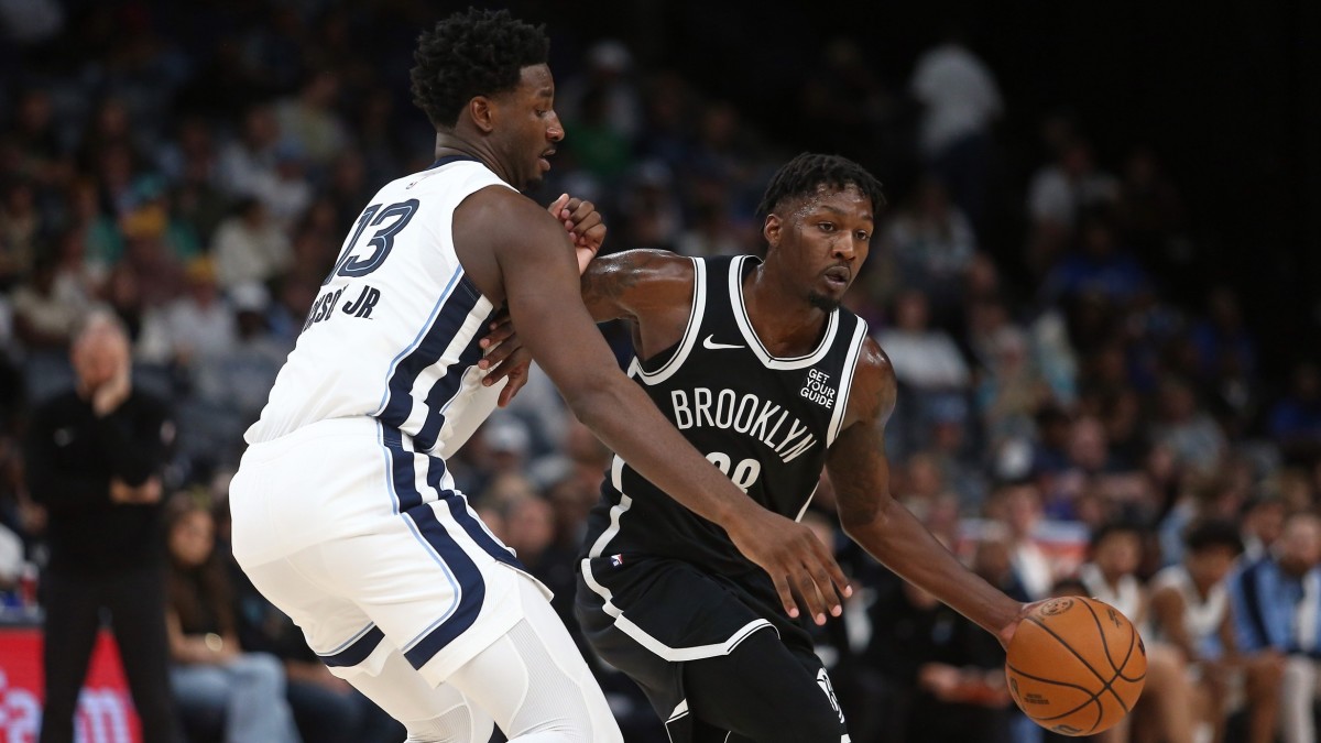 Oct 30, 2024; Memphis, Tennessee, USA; Brooklyn Nets forward Dorian Finney-Smith (28) dribbles as Memphis Grizzlies forward Jaren Jackson Jr. (13) defends during the first half at FedExForum. Mandatory Credit: Petre Thomas-Imagn Images