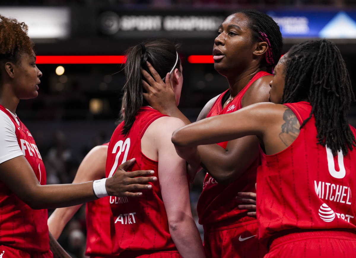 Indiana Fever forward Aliyah Boston comforts Indiana Fever guard Caitlin Clark