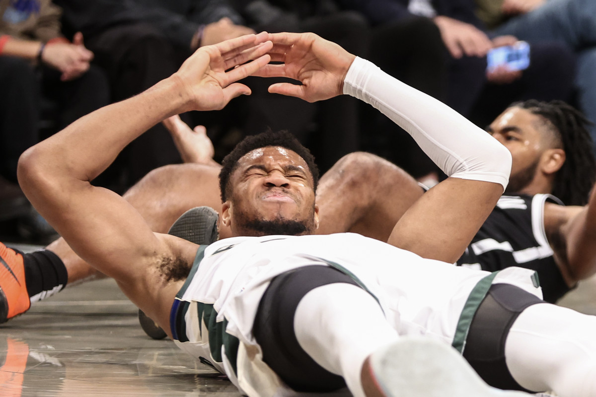 Oct 27, 2024; Brooklyn, New York, USA; Milwaukee Bucks forward Giannis Antetokounmpo (34) reacts after falling to the floor in the first quarter against the Brooklyn Nets at Barclays Center. Mandatory Credit: Wendell Cruz-Imagn Images