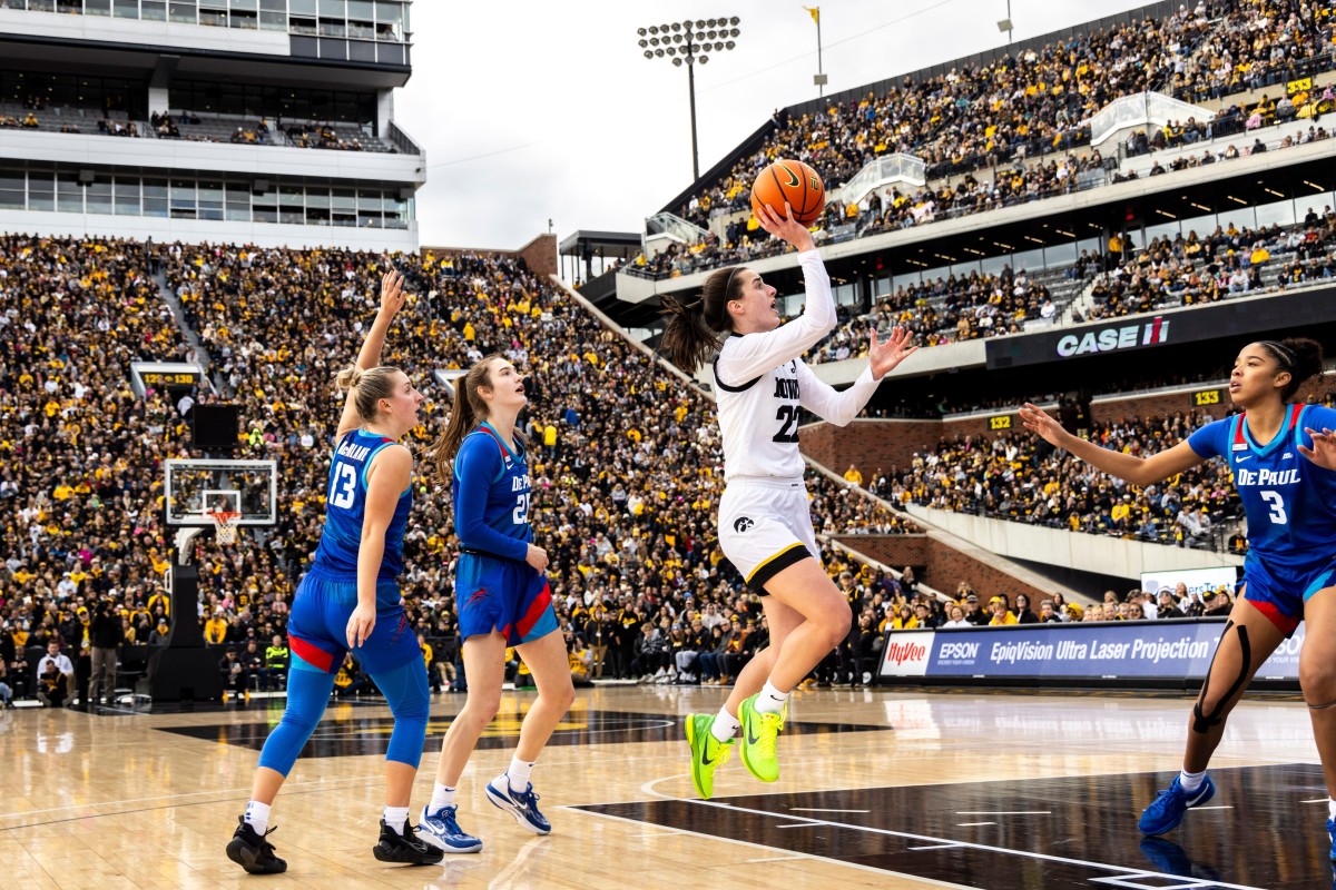 Iowa guard Caitlin Clark shoots a basket during the Crossover at Kinnick women’s basketball exhibition game against DePaul on Oct. 15, 2023, at Kinnick Stadium in Iowa City.