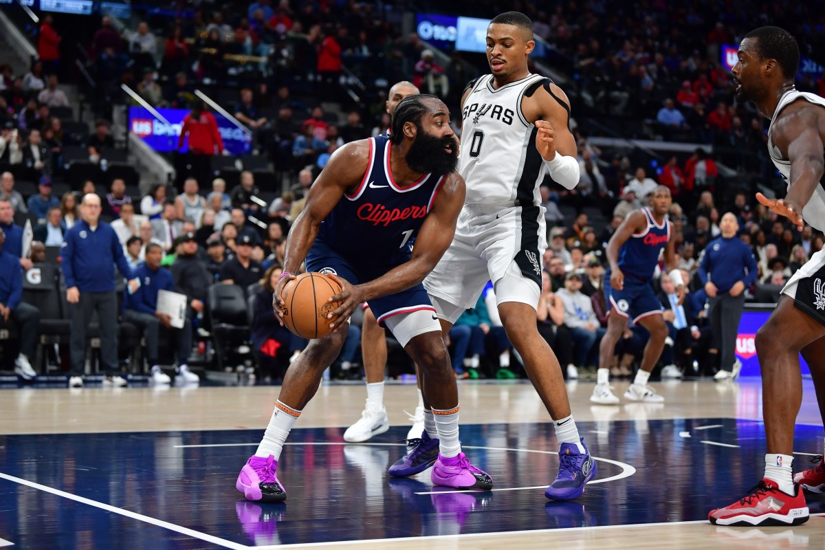 USA: Los Angeles Clippers guard James Harden (1) controls the ball against San Antonio Spurs forward Keldon Johnson (0) during the second half at Intuit Dome.