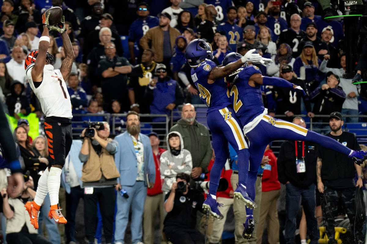 Cincinnati Bengals wide receiver Ja'Marr Chase (1) catches a touchdown pass as Baltimore Ravens kicker Justin Tucker (9) and Baltimore Ravens cornerback Nate Wiggins (2) defend in the fourth quarter of the NFL game at M&T Banks Stadium in Baltimore on Thursday, Nov. 7, 2024.