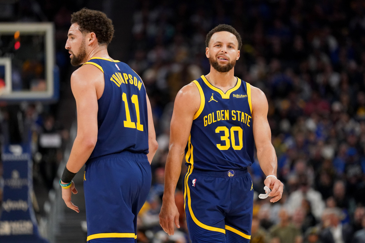 Golden State Warriors guard Stephen Curry (30) stands next to guard Klay Thompson (11)