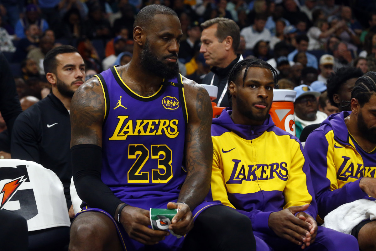 Los Angeles Lakers forward LeBron James (23) and guard Bronny James (9)