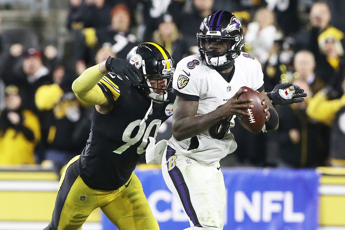 Dec 5, 2021; Pittsburgh, Pennsylvania, USA; Pittsburgh Steelers outside linebacker T.J. Watt (90) pressures Baltimore Ravens quarterback Lamar Jackson (8) during the fourth quarter at Heinz Field. Pittsburgh won 20-19. Mandatory Credit: Charles LeClaire-Imagn Images