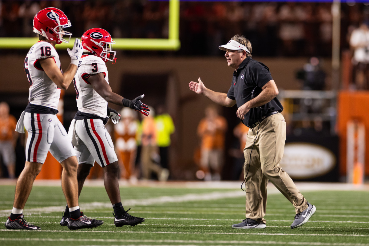 Georgia Bulldogs head coach Kirby Smart celebrates with his players during the first half against the Texas Longhorns.