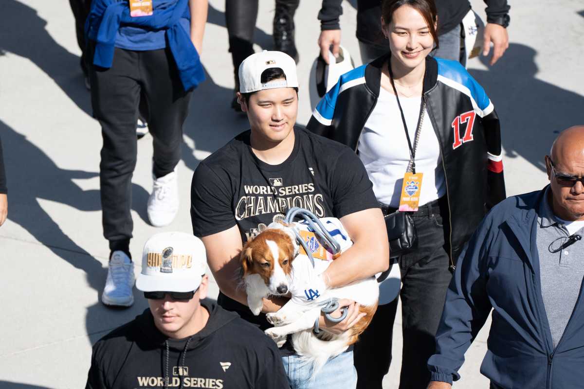 Los Angeles Dodger Shohei Ohtani, wife Mamiko Tanaka and dog Decoy arrive at Dodger Stadium for the team’s World Series Championship celebration on Nov. 1, 2024.