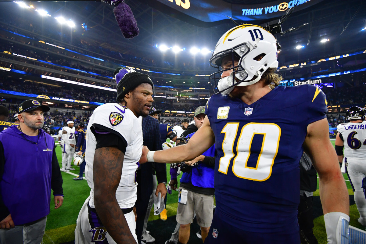 Baltimore Ravens quarterback Lamar Jackson (8) meets with Los Angeles Chargers quarterback Justin Herbert (10)