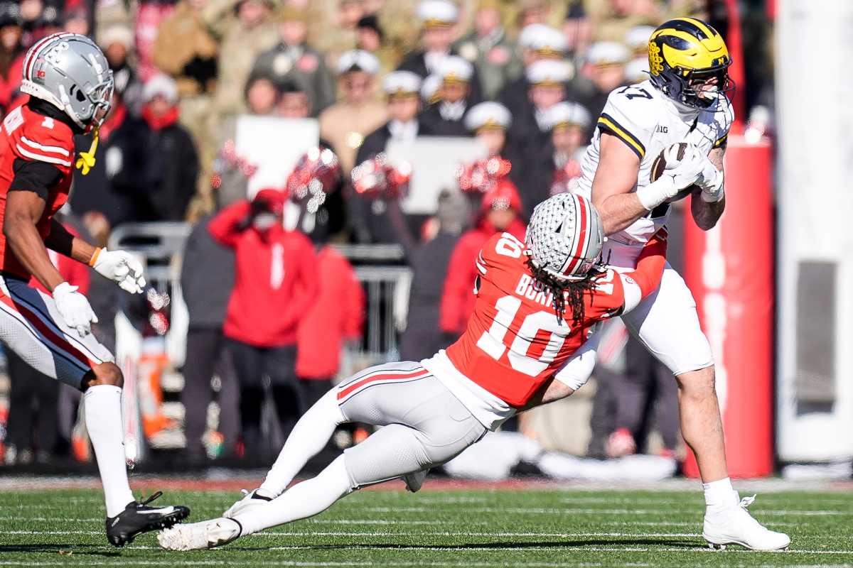 Ohio State Buckeyes cornerback Denzel Burke and Michigan Wolverines tight end Marlin Klein