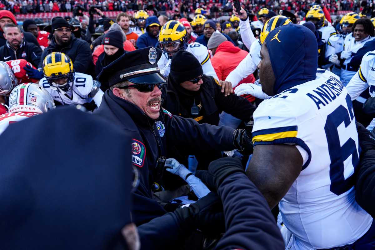 Michigan and Ohio State players fight