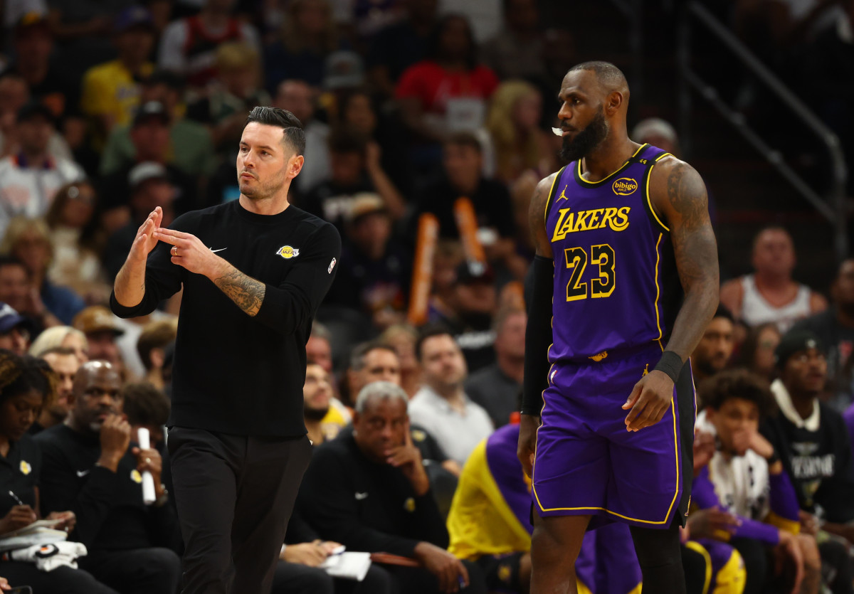 Los Angeles Lakers coach JJ Redick with forward LeBron James at Footprint Center.