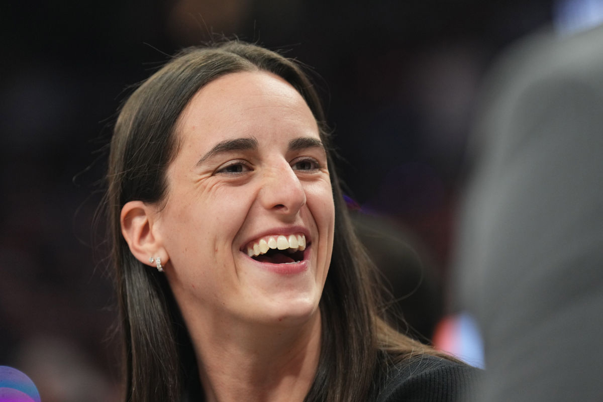 Indiana Fever player Caitlin Clark enjoys the game at Footprint Center.