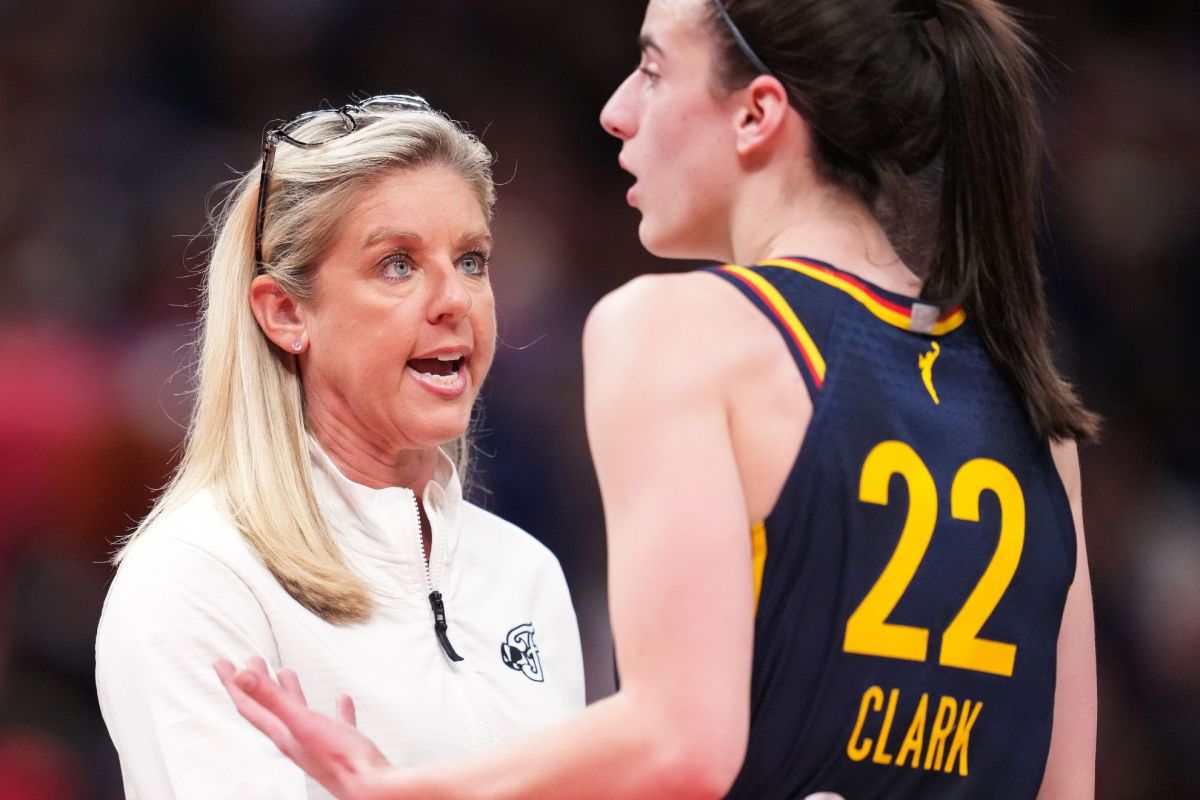 Former Indiana Fever head coach Christie Sides talks to guard Caitlin Clark