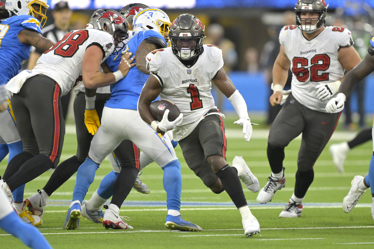 Dec 15, 2024; Inglewood, California, USA; Tampa Bay Buccaneers running back Rachaad White (1) carries the ball for a 7-yard gain in the second half against the Los Angeles Chargers at SoFi Stadium.