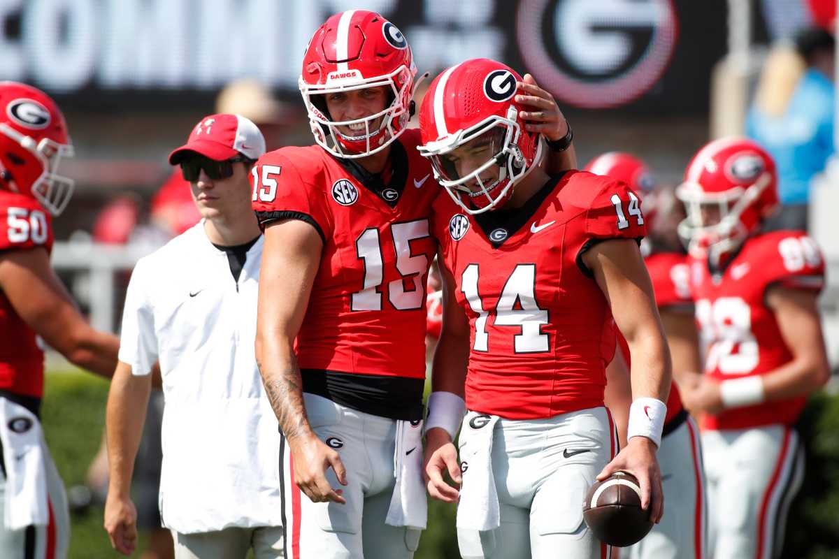 Georgia QBs Carson Beck (15) and Gunner Stockton (14) get ready before the start of a NCAA college football game against Ball State.