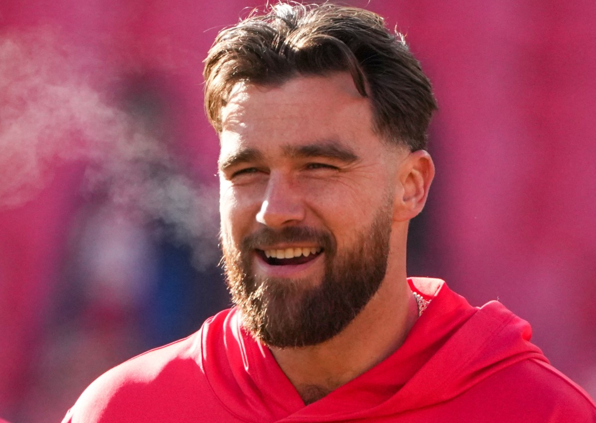 Dec 21, 2024; Kansas City, Missouri, USA; Kansas City Chiefs tight end Travis Kelce (87) laughs with tight end Noah Gray (83) during warm ups against the Houston Texans prior to a game at GEHA Field at Arrowhead Stadium. Mandatory Credit: Denny Medley-Imagn Images  