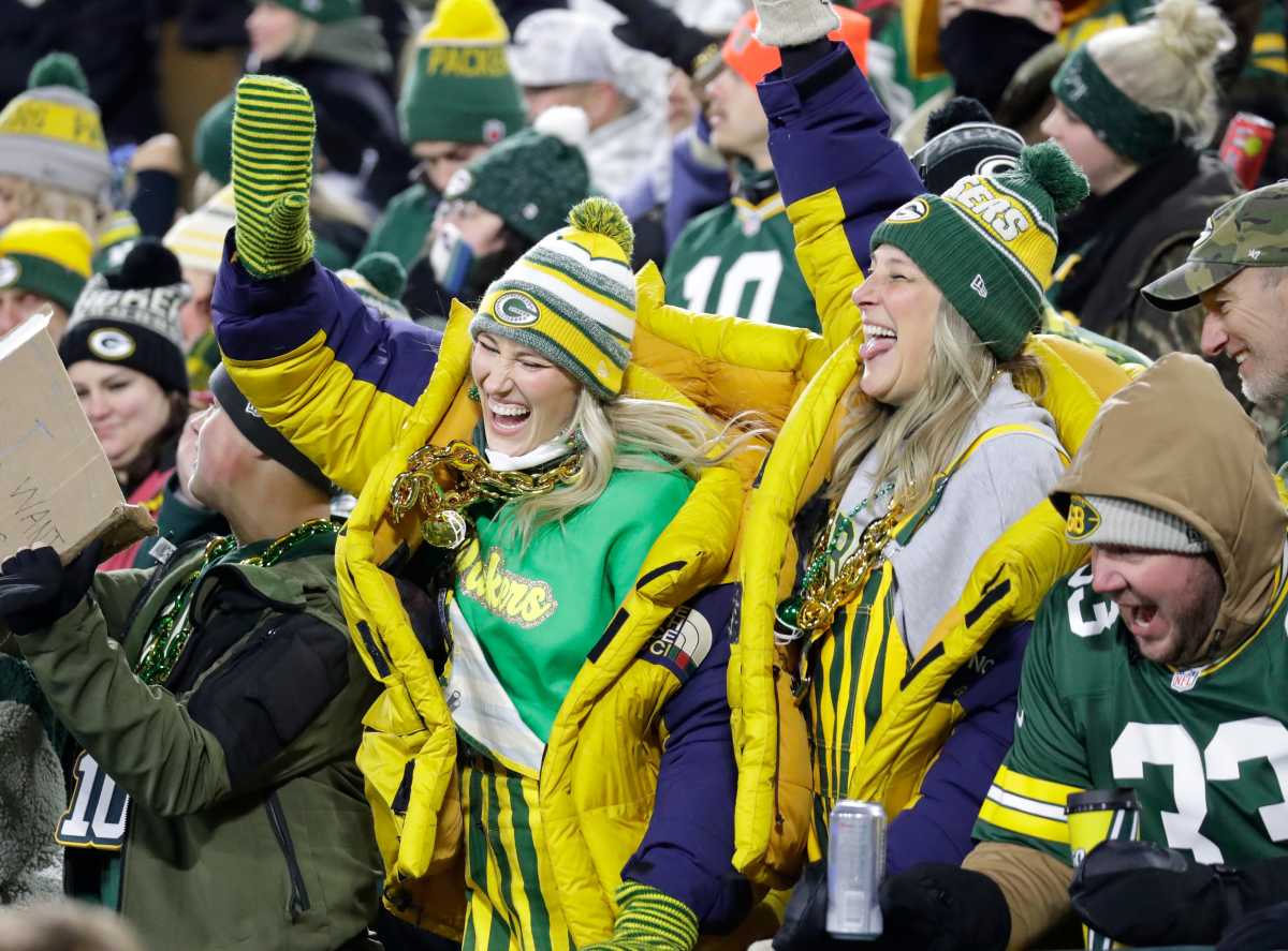 Green Bay Packers fans celebrate late in the fourth quarter against the New Orleans Saints during their football game Monday, December 23, 2024, at Lambeau Field in Green Bay, Wisconsin.  