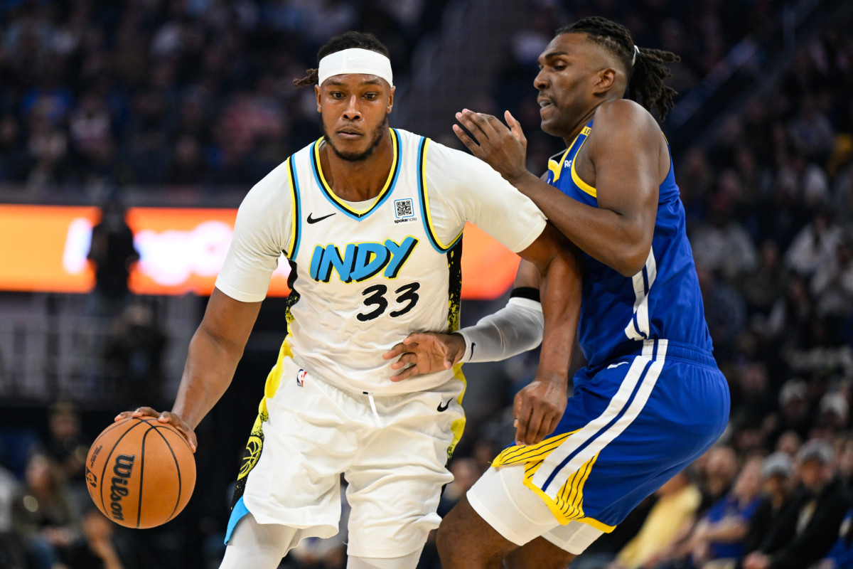 Dec 23, 2024; San Francisco, California, USA; Indiana Pacers center Myles Turner (33) dribbles against Golden State Warriors forward Kevon Looney (5) in the first quarter at Chase Center. Mandatory Credit: Eakin Howard-Imagn Images