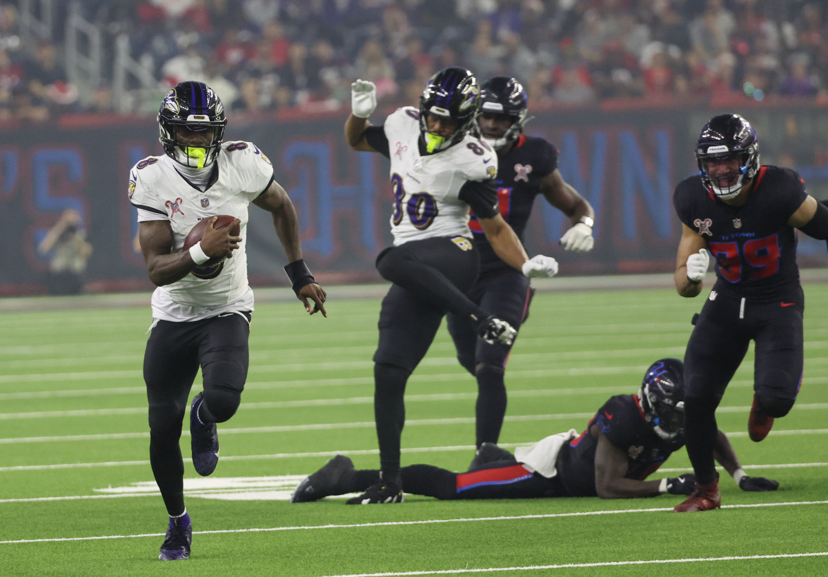 Dec 25, 2024; Houston, Texas, USA; Baltimore Ravens quarterback Lamar Jackson (8) rushes for a 48 yard touchdown against the Houston Texans in the third quarter at NRG Stadium. Mandatory Credit: Thomas Shea-Imagn Images