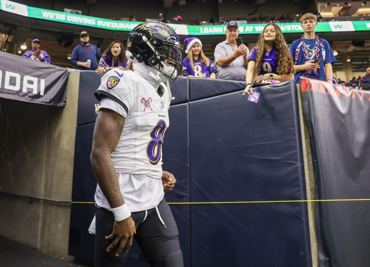 Dec 25, 2024; Houston, Texas, USA; Baltimore Ravens quarterback Lamar Jackson (8) runs out onto the field before playing against the Houston Texans at NRG Stadium. Mandatory Credit: Thomas Shea-Imagn Images