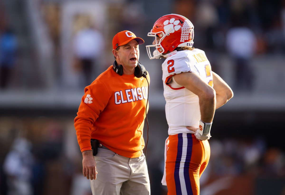 Clemson Tigers head coach Dabo Swinney with quarterback Cade Klubnik (2). 