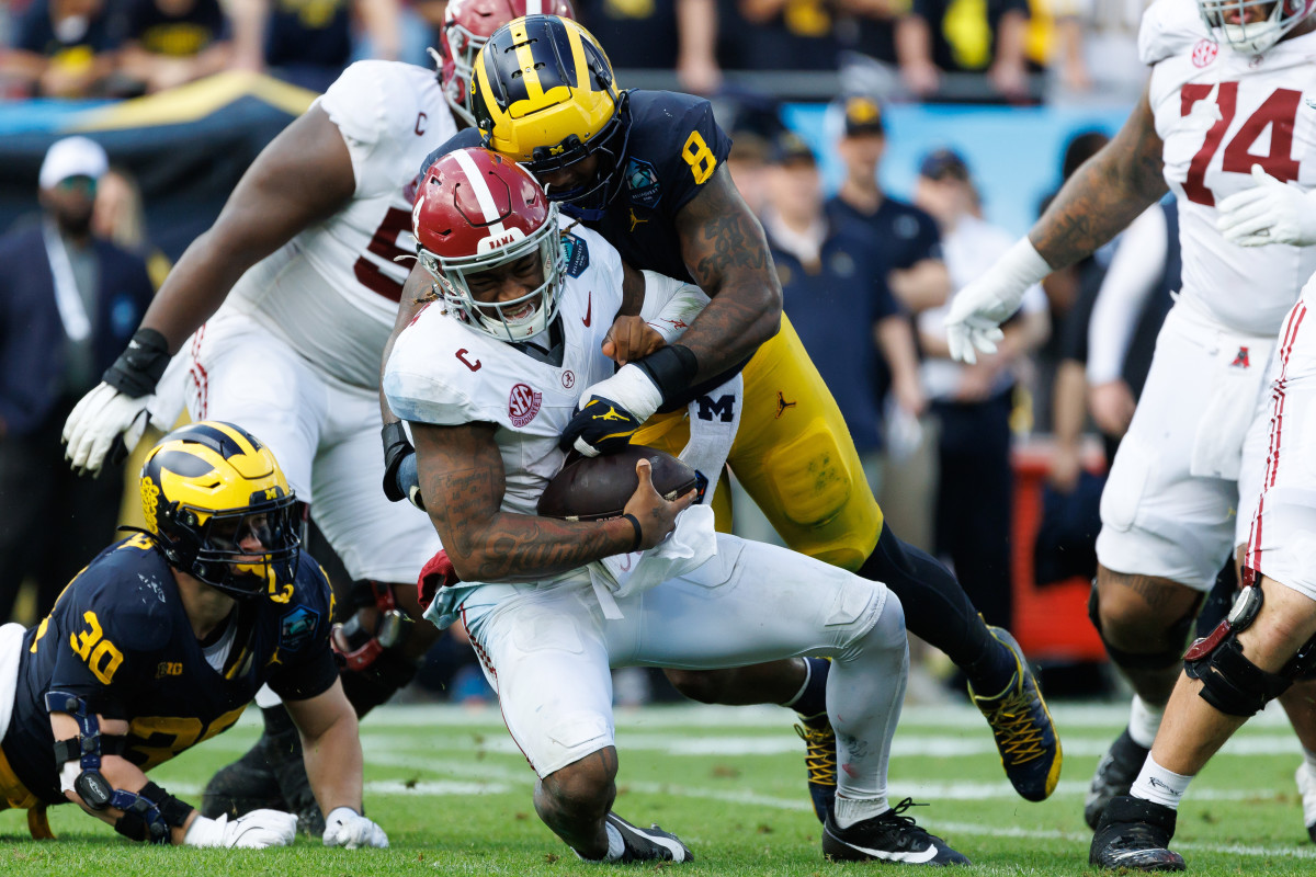 Michigan Wolverines defensive end Derrick Moore (8) sacks Alabama Crimson Tide quarterback Jalen Milroe (4).