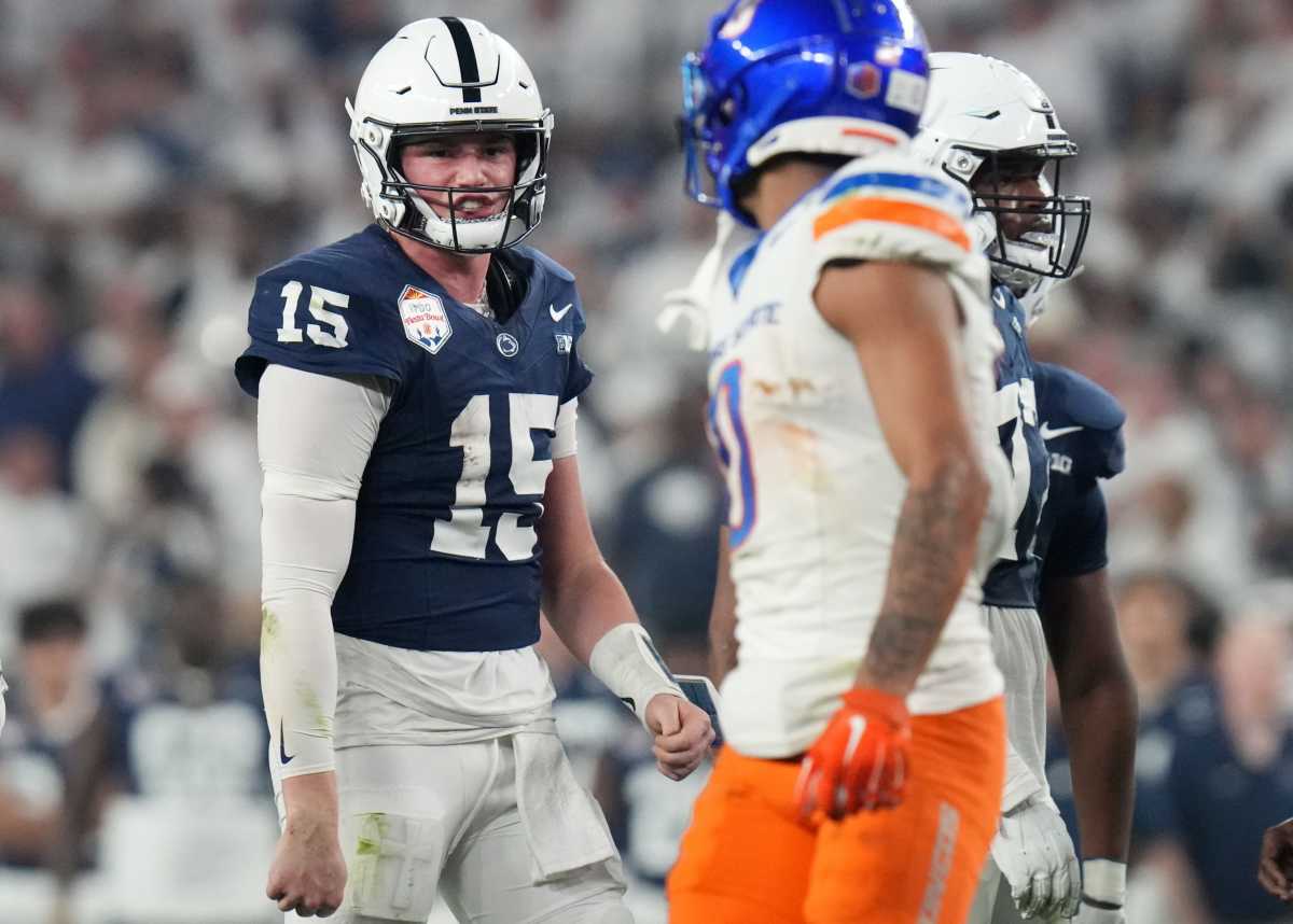 Penn State Nittany Lions quarterback Drew Allar (15) yells out to Boise State Broncos safety Ty Benefield (0) after being sacked during their Vrbo Fiesta Bowl matchup at State Farm Stadium on Dec. 31, 2024.