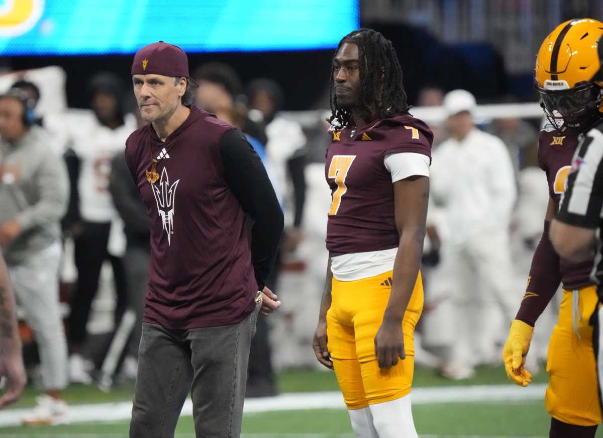 Jake Plummer walks out for the coin toss vs. Texas.