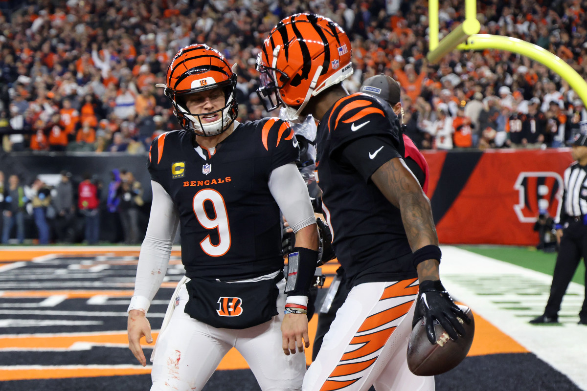 Cincinnati Bengals QB Joe Burrow (9) celebrates following his touchdown pass to wide receiver Tee Higgins (5).