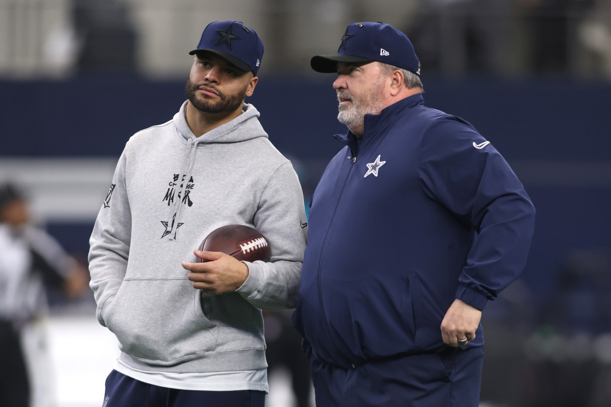 Dallas Cowboys quarterback Dak Prescott and head coach Mike McCarthy talk before a game against the Washington Commanders.