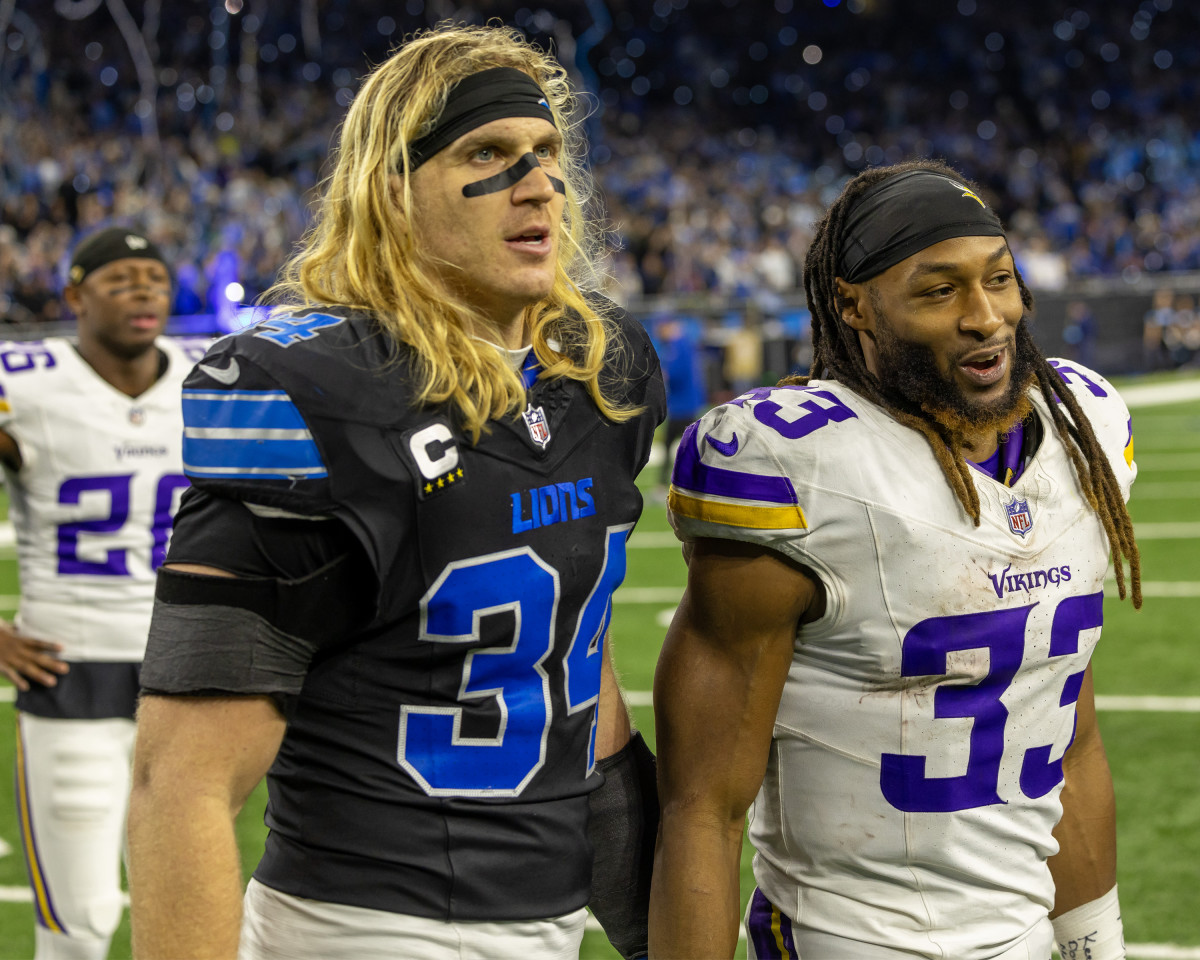 Lions linebacker Alex Anzalone speaks with Aaron Jones of the Vikings after Sunday's game in Detroit.