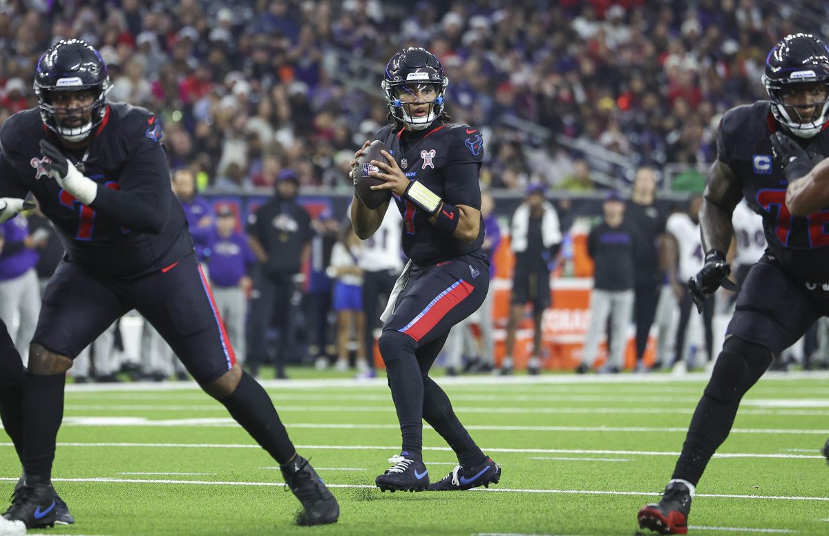 Dec 25, 2024; Houston, Texas, USA; Houston Texans quarterback C.J. Stroud (7) looks for an open receiver during the game against the Baltimore Ravens at NRG Stadium. Mandatory Credit: Troy Taormina-Imagn Images