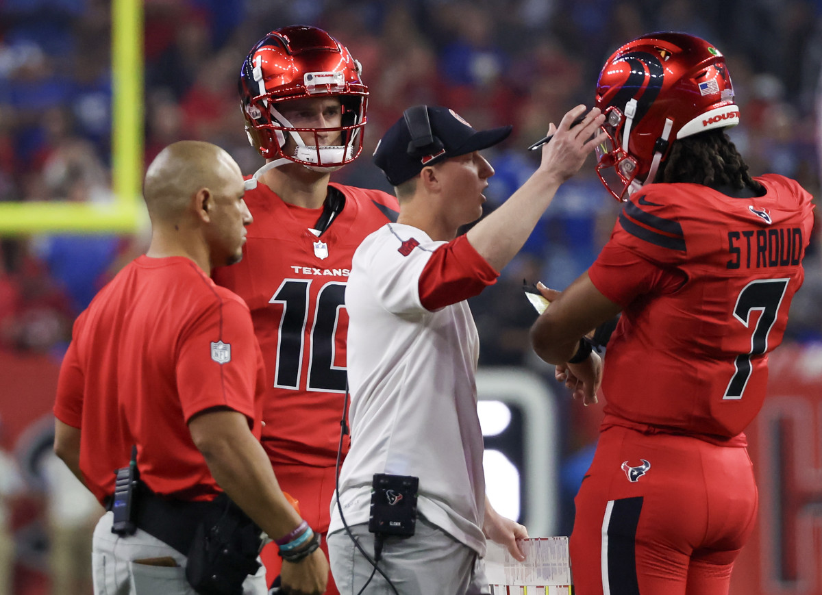 Nov 10, 2024; Houston, Texas, USA; Houston Texans quarterback C.J. Stroud (7) talks with offensive coordinator Bobby Slowik during a Detroit Lions timeout in the first quarter at NRG Stadium. Mandatory Credit: Thomas B. Shea-Imagn Images