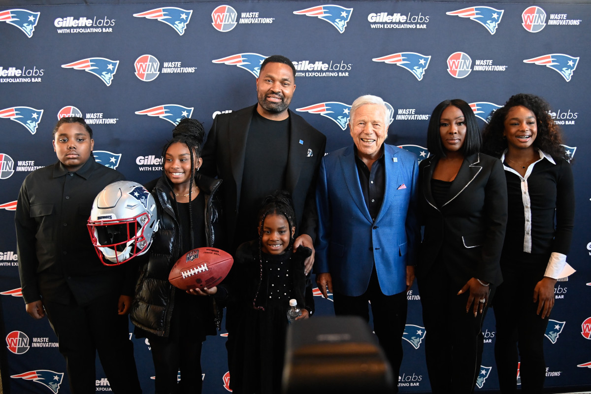 Jan 17, 2024; Foxborough, MA, USA; New England Patriots owner Robert Kraft poses with head coach Jerod Mayo and his family after a press conference at Gillette Stadium. Pictured from left to right; son Jerod Jr 12, daughter Chyanne 9, daughter Chylo 6, Jerod Sr., Robert Kraft, wife Chantel, daughter Chya 13. Mandatory Credit: Eric Canha-Imagn Images  