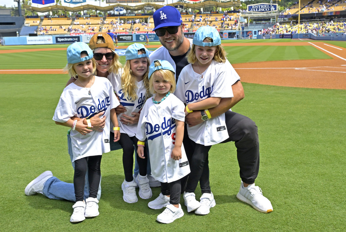 Los Angeles Rams quarterback Matthew Stafford (9) with his wife Kelly with their 4 daughters on the field prior to the game between the Los Angeles Dodgers and the Atlanta Braves at Dodger Stadium. Stafford was at the game on Rams day. Mandatory Credit: Jayne Kamin-Oncea-Imagn Images