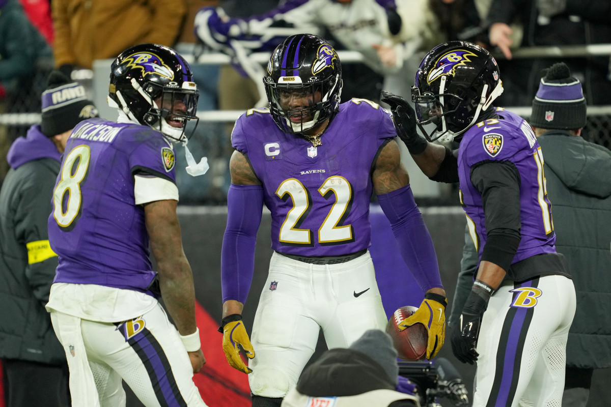 Jan 11, 2025; Baltimore, Maryland, USA; Baltimore Ravens running back Derrick Henry (22) celebrates with wide receiver Nelson Agholor (15) and quarterback Lamar Jackson (8) after scoring a touchdown against the Pittsburgh Steelers in the third quarter in an AFC wild card game at M&T Bank Stadium. Mandatory Credit: Mitch Stringer-Imagn Images