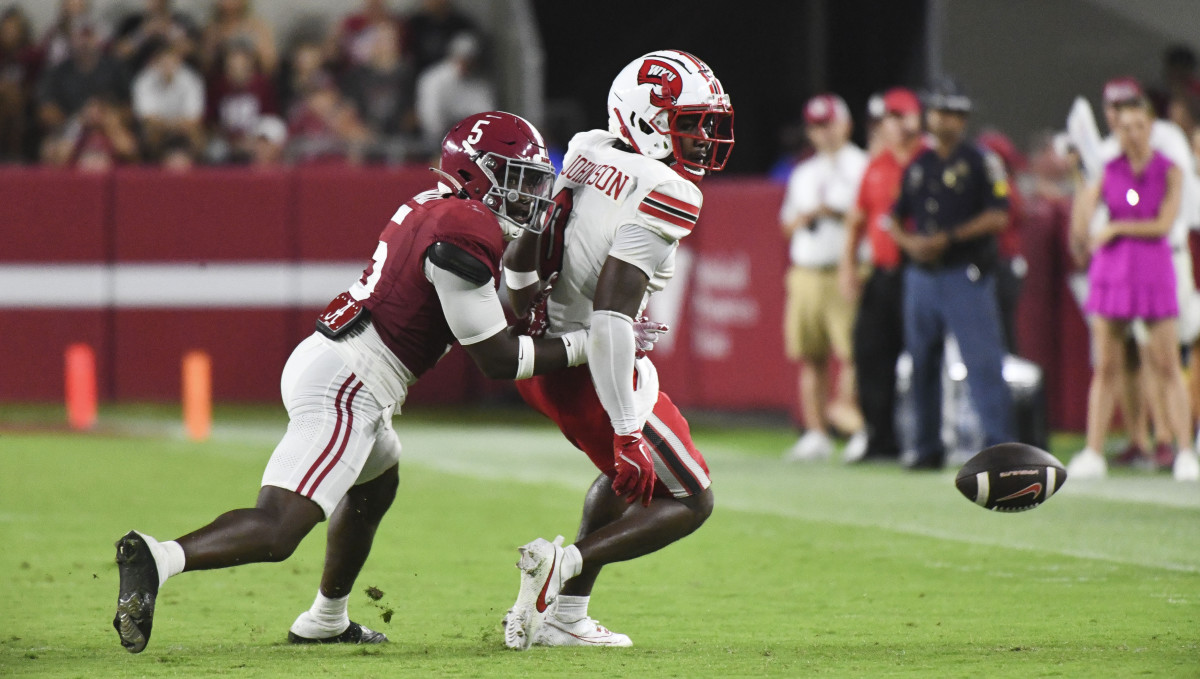 Alabama Crimson Tide defensive back King Mack (5) and Western Kentucky wide receiver Kisean Johnson (0)