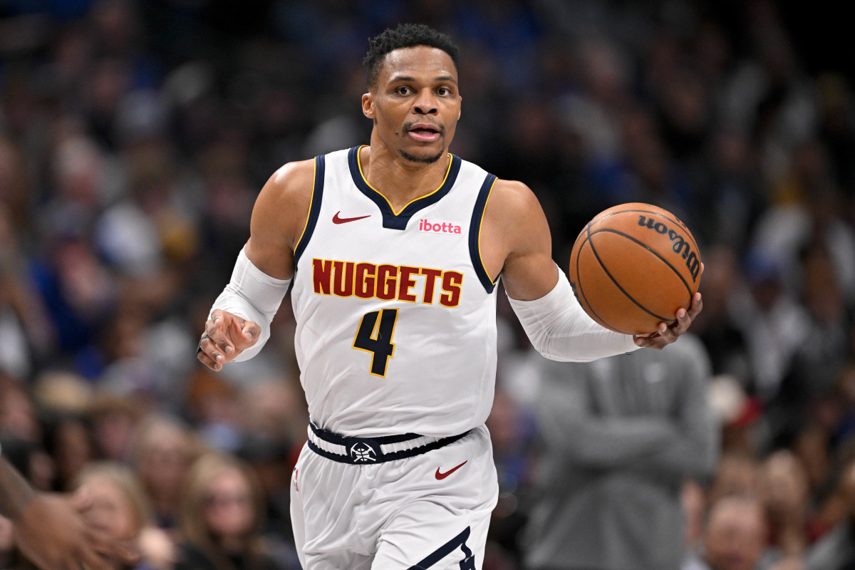 Denver Nuggets guard Russell Westbrook sets the play during a game.