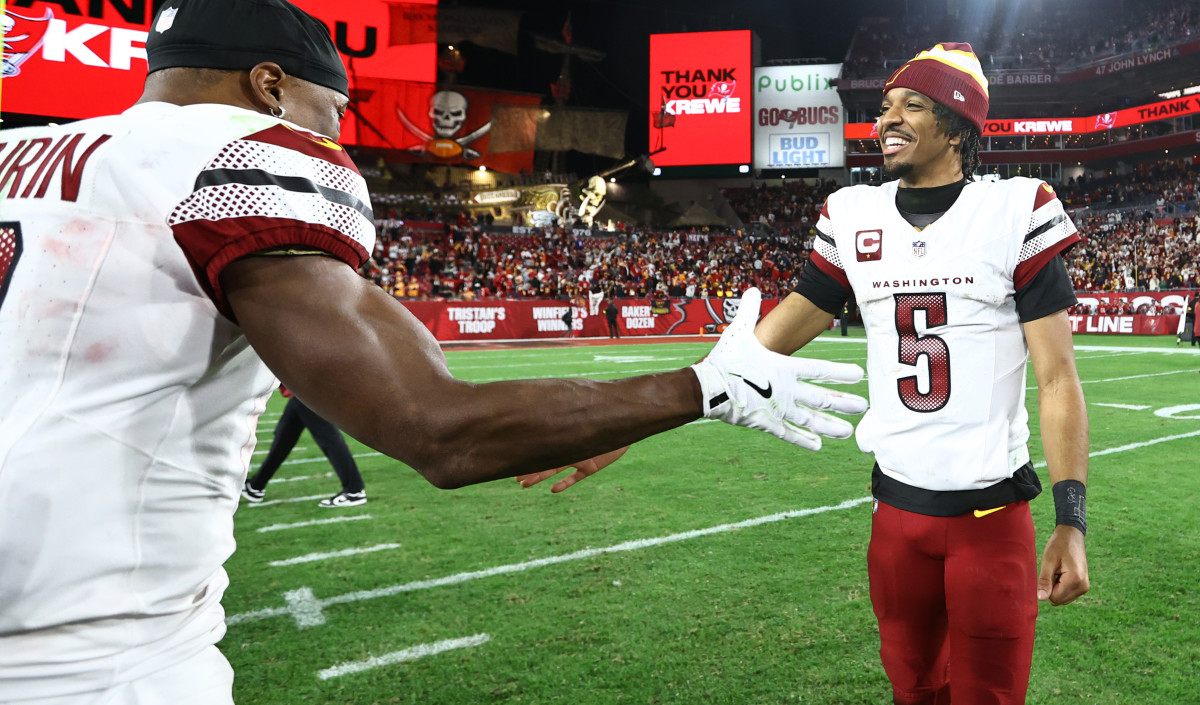 Jayden Daniels celebrates with Terry McLaurin after the Commanders' win at Tampa Bay.