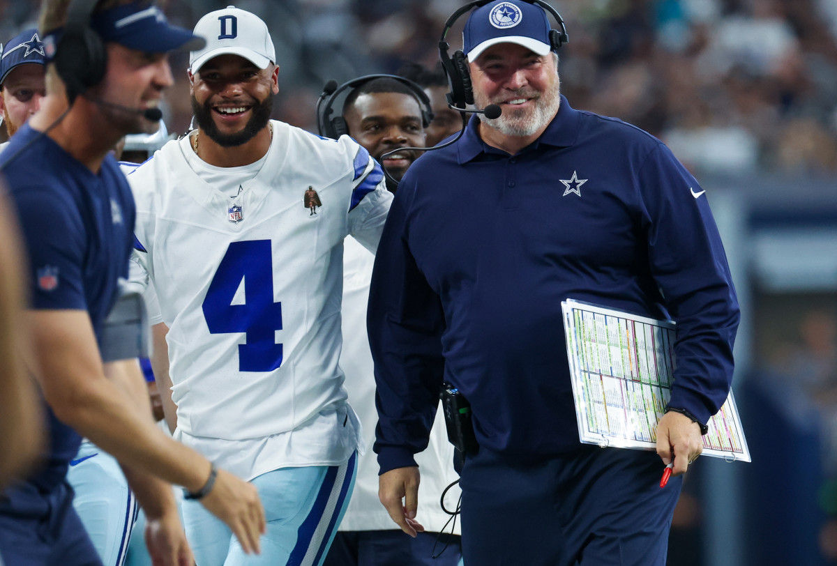 Ex-Dallas Cowboys head coach Mike McCarthy laughs with Dallas Cowboys quarterback Dak Prescott after a touchdown.