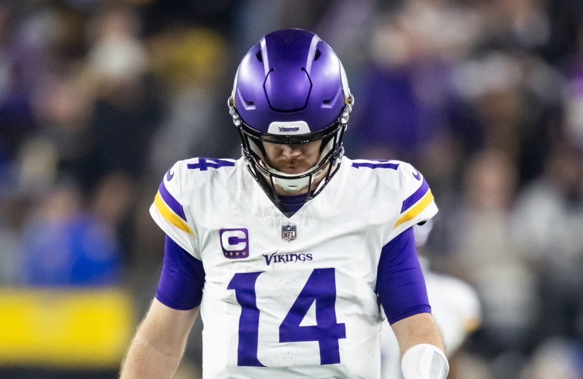 Jan 13, 2025; Glendale, AZ, USA; Minnesota Vikings quarterback Sam Darnold (14) reacts against the Los Angeles Rams in the second half during an NFC wild card game at State Farm Stadium. Mandatory Credit: Mark J. Rebilas-Imagn Images  