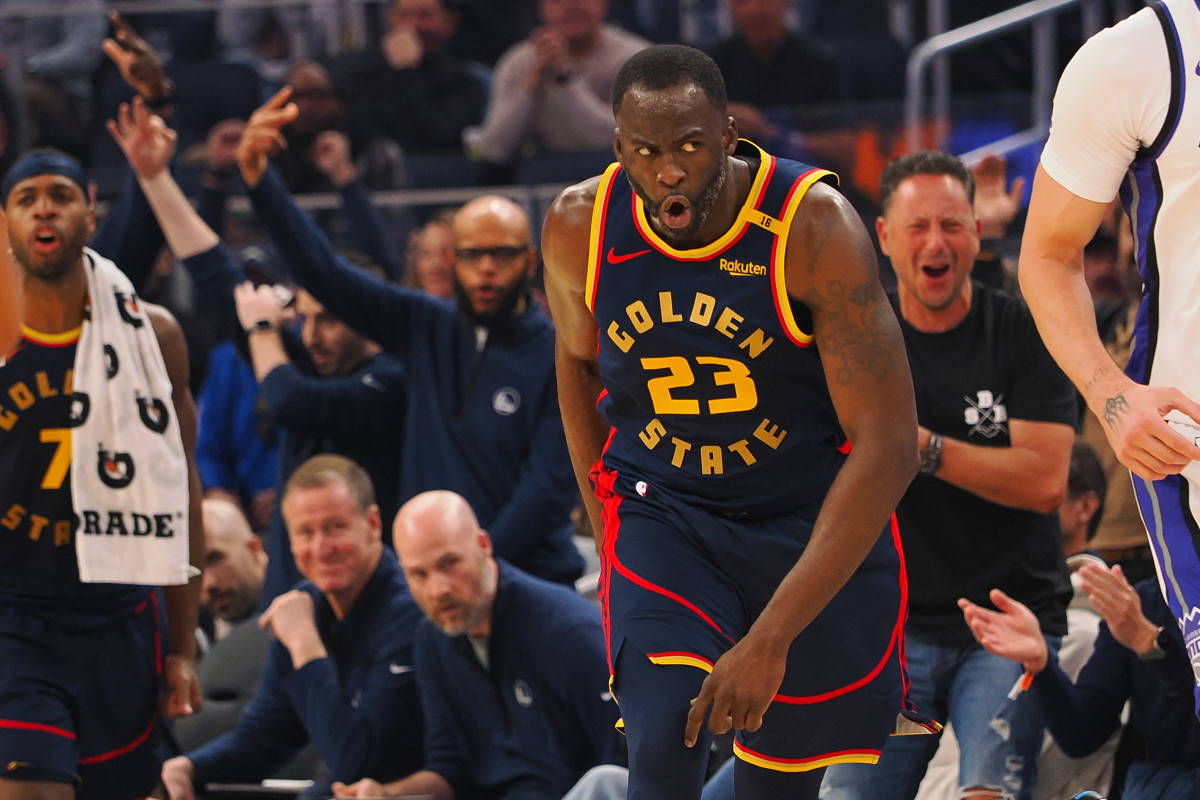 Golden State Warriors forward Draymond Green reacts after making a basket.