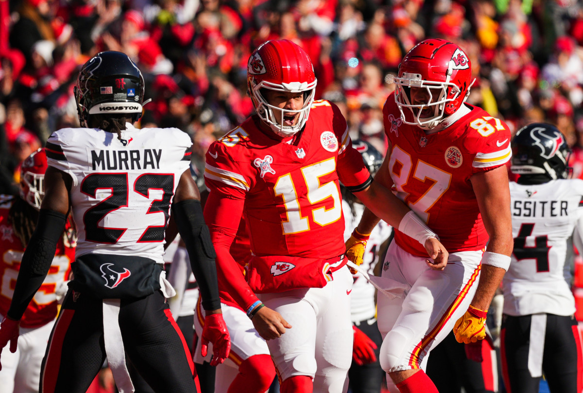 Dec 21, 2024; Kansas City, Missouri, USA; Kansas City Chiefs quarterback Patrick Mahomes (15) celebrates with tight end Travis Kelce (87) after scoring a touchdown during the first half against the Houston Texans at GEHA Field at Arrowhead Stadium. Mandatory Credit: Jay Biggerstaff-Imagn Images