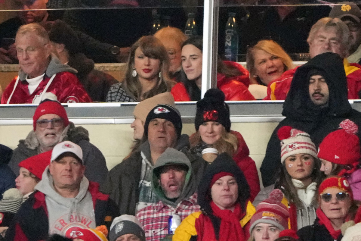 Jan 18, 2025; Kansas City, Missouri, USA; Recording artist Taylor Swift (upper middle) sits with Indiana Fever guard Caitlin Clark (upper right) during the fourth quarter of a 2025 AFC divisional round game between the Kansas City Chiefs and the Houston Texans at GEHA Field at Arrowhead Stadium. Mandatory Credit: Denny Medley-Imagn Images 