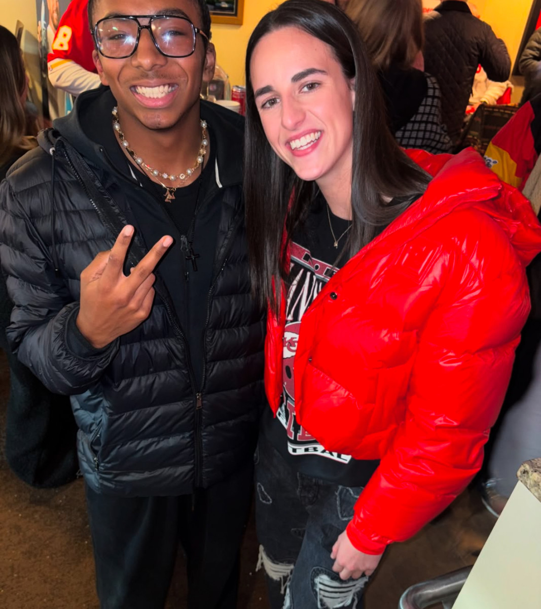 Caitlin Clark poses with Chiefs tight end Travis Kelce's friend at Arrowhead Stadium on Jan. 18, 2025.