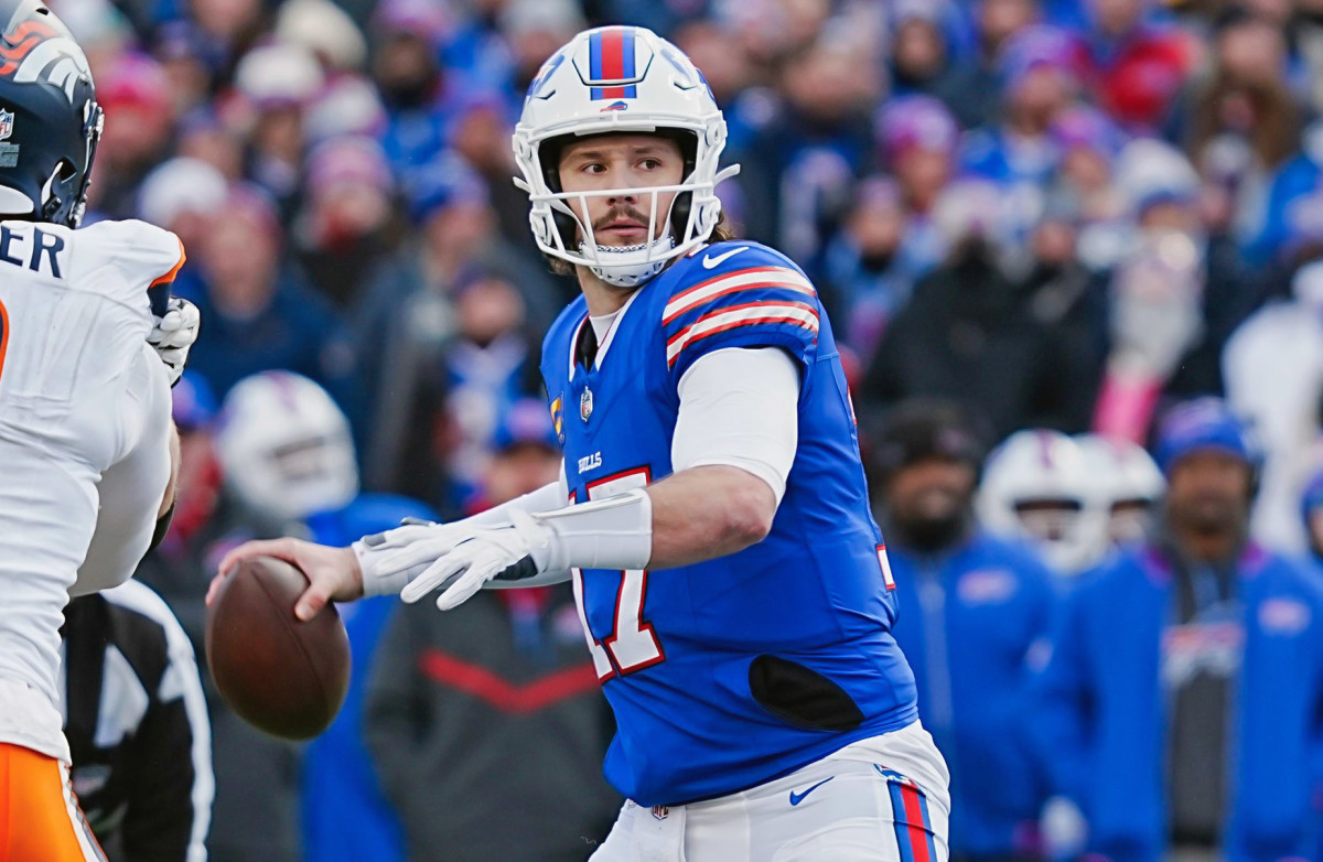 Buffalo Bills quarterback Josh Allen (17) throws a long pass during the second half of the Buffalo Bills wild card game against the Denver Broncos.