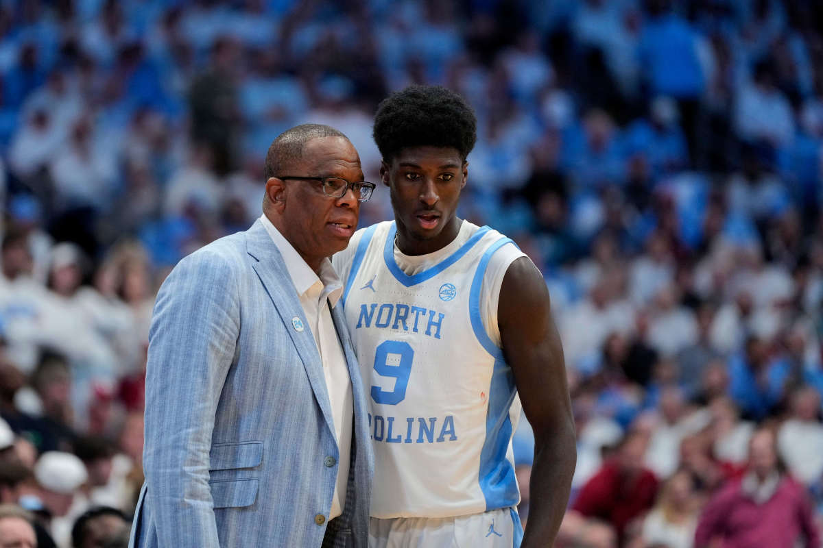 Dec 4, 2024; Chapel Hill, North Carolina, USA; North Carolina Tar Heels head coach Hubert Davis talks with guard Drake Powell (9) in the second half at Dean E. Smith Center. Mandatory Credit: Bob Donnan-Imagn Images