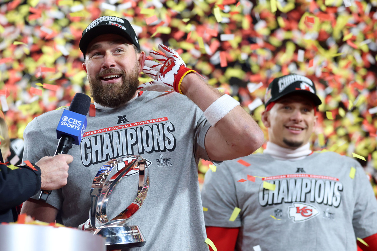 Kansas City Chiefs TE Travis Kelce celebrates on stage after defeating the Buffalo Bills in the AFC Championship Game at Arrowhead Stadium.