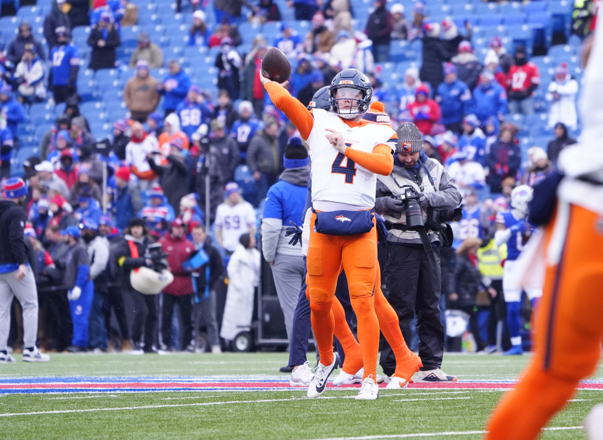 Zach Wilson of the Broncos warms up before a game vs. the Bills.